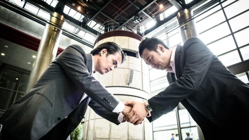 japanese men shaking hands