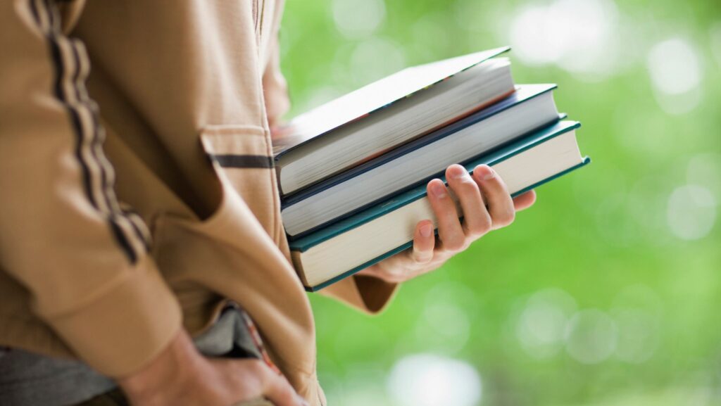 person bringing jlpt textbooks