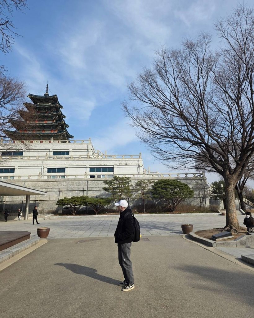 Leon standing in front of a temple in South Korea during his exchange semester