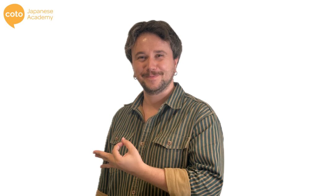 A Japanese hand gesture that looks like an upside down okay sign. It's means something was expensive or someone has a lot of money.