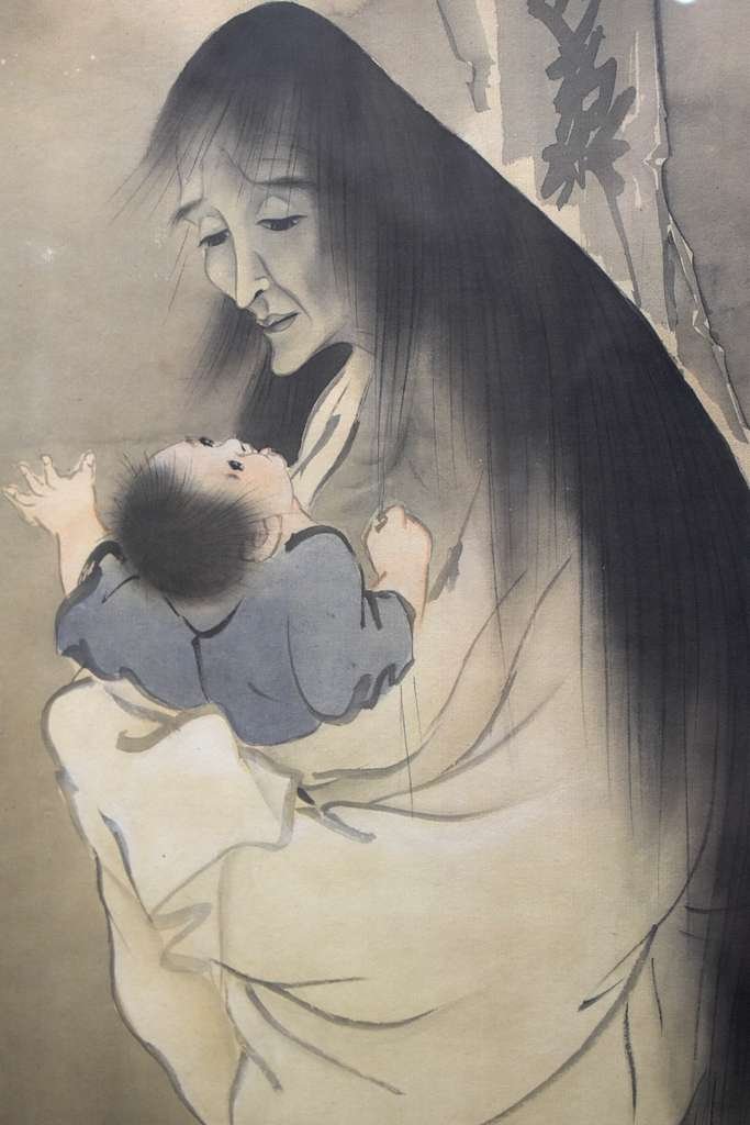A ukiyo-e print of an umube, or a Japanese yurei who died shortly after giving child birth, holding her baby